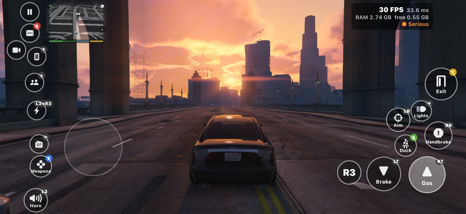 Driving toward the Los Santos skyline at sunset.