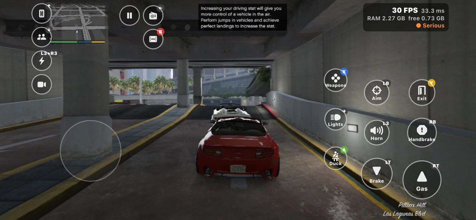 A red convertible leaving a parking garage in Pillbox Hill.